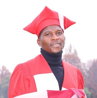 Dr. Anderson Munengwa in graduation regalia
